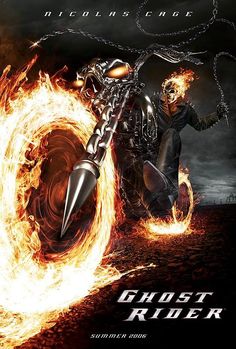 a man riding on the back of a motorcycle with flames coming out of it's tires