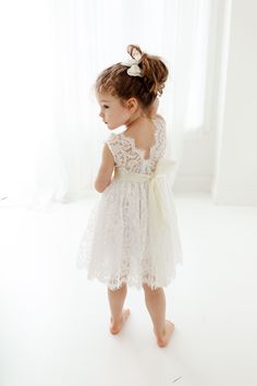 "This stunning dress is a beautiful vintage inspired look...perfect for any little girl and occasion! This white dress has a boho flair and a super feminine feel with the soft vintage inspired lace. The V back with unfinished lace and hem creates the perfect amount of bohemian vibes. Nicolette's Couture is a family owned boutique based out of Dubuque, Iowa. When creating looks, comfort is our main priority...regardless of how chic a style is. We've had amazing success so far and believe our stor White Tulle Wedding Dress, White Tutu Skirt, Dubuque Iowa, Flower Girl Proposal, Boho Flower Girl, White Tutu, White Lace Wedding Dress, Ivory Lace Dress, White Flower Girl Dresses