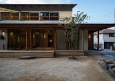 a modern house with wooden steps leading up to it