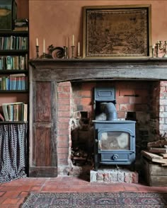 an old fireplace with a wood burning stove