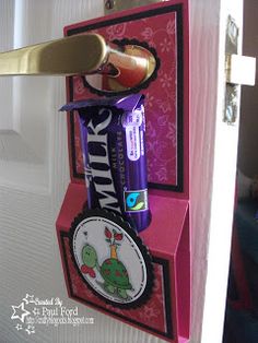 this is an image of a door hanger with toothpaste and other items