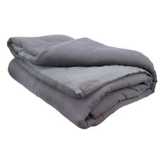 two blankets folded on top of each other in grey and white colors, with one blanket folded