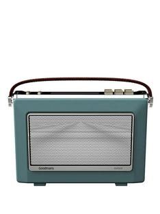 an old fashioned blue radio sitting on top of a table