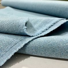 blue jeans folded on top of each other