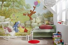 a child's room with winnie the pooh mural