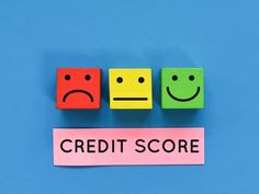 the word credit score written on colorful blocks with smiley faces