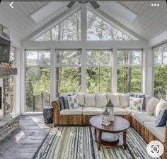 a living room filled with furniture and a fire place