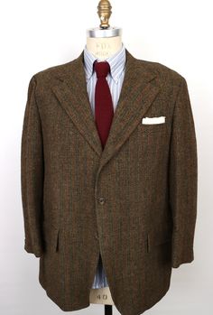 "\"Guest of Honor\" vintage 1970s (to late 60s) Harris Tweed sport coat by historic menswear label Hampton Clothes in rich, dark brown-ish, green-ish 100% virgin Scottish wool Harris Tweed with vintage high quality you can see and feel and a charming, subtle multicolor vertical weave to the tweed that gives it added warmth and dimension, featuring: 3-button front with shorter, wider notch lapel and swollen \"French seams\" or edges, and textured dark brown buttons that evoke bark; welt chest poc Brown Wool Sport Coat With Flat Front, Retro Formal Tweed Blazer, Vintage Single Breasted Tweed Jacket, Vintage Single Breasted Tweed Jacket With Long Sleeves, Vintage Tweed Jacket For Fall Semi-formal Events, Retro Brown Tweed Jacket For Business, Retro Tweed Jacket For Business, Retro Brown Tweed Blazer, Vintage Green Sport Coat For Fall