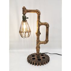 a lamp made out of pipes and gears