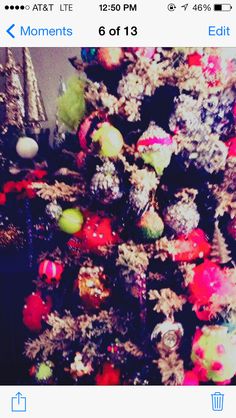 the christmas tree is decorated with colorful ornaments