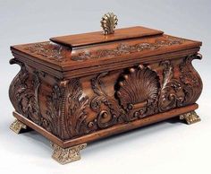 an ornately carved wooden box is on display