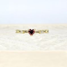 Petite 18k Yellow Gold Heart Shaped Ruby July Birthstone Delicate Dainty Ring Size 7 18k Yellow Gold Plated This Ring Is True To Its Beauty!!! The Detail And Sheer Sparkle Is Absolutely Stunning!! Wear Your Heart On Your Finger, Or Gift This To The Love Of Your Life! This Heart Shaped Solitaire Gemstone Sits Pretty On A 18k Yellow Gold Plated Band. This Lab Created Ruby Is A Shiny Red Gem Teeming With Fire And Brilliance. #Goldplated #Ringsize7 #Size7ring #Julybirthstone #Ruby Red Fashion Gold P Valentine's Day Dainty Cubic Zirconia Rings, Dainty Heart Shaped Birthstone Promise Ring, Dainty Heart-shaped Promise Birthstone Ring, Dainty Heart Birthstone Promise Ring, Elegant Red Heart Ring In 14k Gold, Elegant Red 14k Gold Heart Ring, Gold Heart Ring With Gemstone For Valentine's Day, Gold Heart Ring With Center Stone For Valentine's Day, Gold Gemstone Heart Ring For Promise