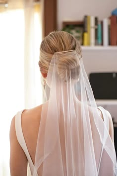 the back of a bride's head wearing a veil