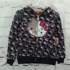 New Product Hello Kitty Long Sleeve, Zippered Front Hooded Sweatshirt. Sequined Kitty On Front. Gray Outlined Kitty Heads With Pink Bow Printed Design. 1c-610=058 Hello Kitty Black, Girls Sweatshirt, Miss Kitty, Clothes Shopping, Girl Coat, Girl Sweatshirts, Pink Bow, Printed Design, Kids Jacket