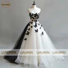 Black Strapless Ball Gown For Wedding, Gothic Wedding Dress Black And White, Black Sweetheart Neckline Ball Gown For Wedding, Black Wedding Gown With Detachable Train, Black Wedding Gown With Sweetheart Neckline, Black Wedding Dress With Sweetheart Neckline, Black Wedding Dress With Fitted Bodice, Black Fitted Dress For Ceremony, Butterfly Dress Prom