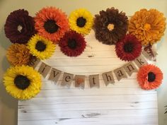 a wooden sign with flowers on it that says givethnang and the words givethnang are spelled out in front of them