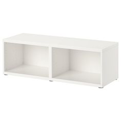 a white shelf with two open shelves on each side