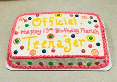 a birthday cake with the name teenager written on it and confetti sprinkles