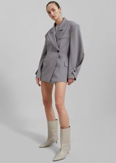 Color: Grey Midweight woven fabric Regular fit Notch lapels Padded shoulders Front flap pockets Illusion breast welt pocket Oversized button cuffs Front button closure  Lined 94% Polyester 6% Elastane Dry Clean
 By The Frankie Shop. Imported Architectural Clothing, Structured Fashion, Boxy Blazer, Clothes Encounters, Boxy Dress, The Frankie Shop, Unique Clothes, Streetwear Inspo, Holiday Brunch