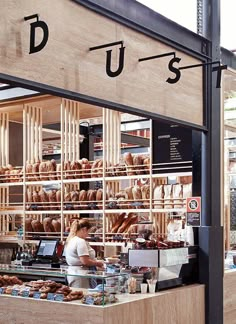 a bakery with lots of donuts on display behind the counter and in front of it