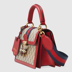 Description An eclectic mixture of historical Gucci details and newly established codes, for the Pre-Fall 2018 the Queen Margaret line is presented in GG canvas, a versatile fabric that continues to pay homage to the House’s roots. Inspired by the ’70s archives, a bee enriched by glass pearls and multicolor crystals defines the closure of this small top handle bag, trimmed in red leather. Size: 10″W x 7″H x 5″D / W25cm x H18cm x D13cm 100% genuine materials, matching the quality of the Gucci pro Queen Margaret, Small Top Handle Bag, Moschino Bag, Gucci Top, Gucci Store, Designer Top, Bag Gucci, Perfect Handbag, Top Handle Bags