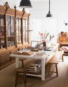 a living room filled with furniture and bookshelves