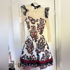 a dress hanging up on a door