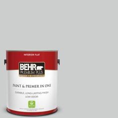 a can of behr paint on a gray background