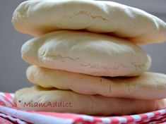 a stack of cookies sitting on top of a red and white towel