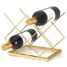 two bottles of wine sitting on top of a metal rack with gold trimmings