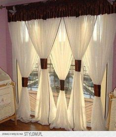 the curtains are hanging in front of the window