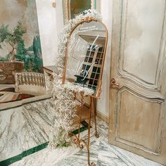 a mirror sitting on top of a marble floor