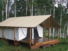 an image of a tent in the grass with trees behind it and text that reads,