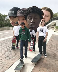 a group of young men standing next to each other on top of a brick walkway