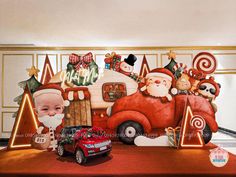 a christmas scene with santa claus and other holiday decorations on the side of a truck