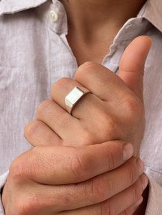 This is a classic square silver signet. A men sterling silver ring that shines for its simplicity. And square geometric male silver signet that can we worn by its self or combined with other rings. Minimal and geometric shapes with their hard angles and edges have long been a source of my inspiration. I always say that the simplicity is the beauty of live. Geometric and minimal jewelry is great for an everyday use. Geometric styles look tidy and chic, with the bonus that they don't get caught on your clothing or hair like other dangly jewelry styles. This is Urban jewelry, for those who not only want to wear special designs but also with meaning.  The surface of the square is 5mm x 7mm. Name of the ring: ETERNAL... live you present. Die with memories, not with dreams. Every time we make a Mens Silver Signet Ring, Rings Minimal, Male Rings, Onyx Ring Men, Urban Jewelry, Ring Square, Ring Man, Silver Signet Ring, Jewelry Styles