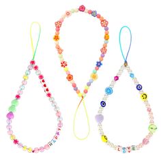 three necklaces with beads and charms on them