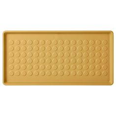 a yellow tray with circles on it