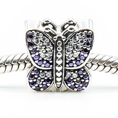 Authentic PANDORA Sparkling Butterfly S925 ALE Sterling Silver Animal Charm With Lavender And Purple Cubic Zirconia 791257ACZ - Retired. Add a little sparkle with this gorgeous sterling silver butterfly covered in pink and lavender Zirconia. This item is retired from production and may be difficult to find. Charm is pre-owned and in great condition. Buy with confidence that all my Pandora items are 100% authentic Pandora. All precious metals are tested and are guaranteed with the Thermo Scientif Whering App, Pandora Black, Butterfly Purple, Pink And Lavender, Murano Glass Beads, Silver Butterfly, Sterling Silver Flowers, Pandora Bracelet, Jewelry Pouch