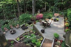 an aerial view of a wooden deck surrounded by trees