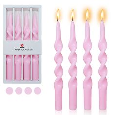 pink candles are lined up in a box