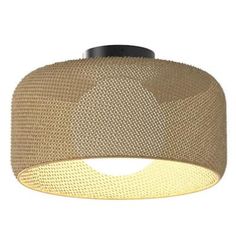 a light that is on top of a ceiling fixture with mesh covering and lightshade