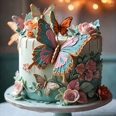 there is a cake decorated with butterflies and flowers