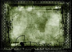 an old photo frame with vines and leaves on it, in black and green tones