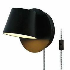 an image of a black wall light with a cord attached to the back of it