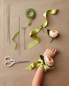 someone is making flowers out of ribbon and scissors