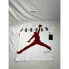 Jordan Jumpman Shirt Size: Large 12/13 Pit To Pit: 17.75” Length: 24.5” Color: White/Red-Black Condition: This Jordan Jumpman Shirt Are Brand New With Tags Attached. Never Been Worn! See All Pics! New With Tags! Ships Within 12 Hrs (Except Sundays) Top Rated Seller Tom Boy Style, Jordan Tshirt, Air Jordan Shirt, Champion Clothing, Jordan Shirt, My Tom, White Jordans, Jordan Shirts, Jordan White