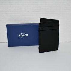 Royce New York Black Magic Leather Wallet Nib Details: Leather Lined Four Interior Card Slots Elastic Webbing Dimensions: 4"L X 3.25"H X 0.25"W Spot Clean New In Box Black Card Holder With Cell Phone Pocket As Gift, Black Card Holder With Cell Phone Pocket For Gift, Black Rectangular Card Holder For Daily Use, Black Wallet With Magnetic Closure For Daily Use, Black Rectangular Card Holder For Business, Elegant Black Rectangular Trifold Wallet, Black Leather Bag With Rfid Blocking, Black Rectangular Wallet For Daily Use, Black Wallet With Magnetic Closure For Travel