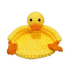 a crocheted yellow ducky hat with orange feet