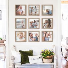 a white bench sitting in front of a wall with pictures on it's sides